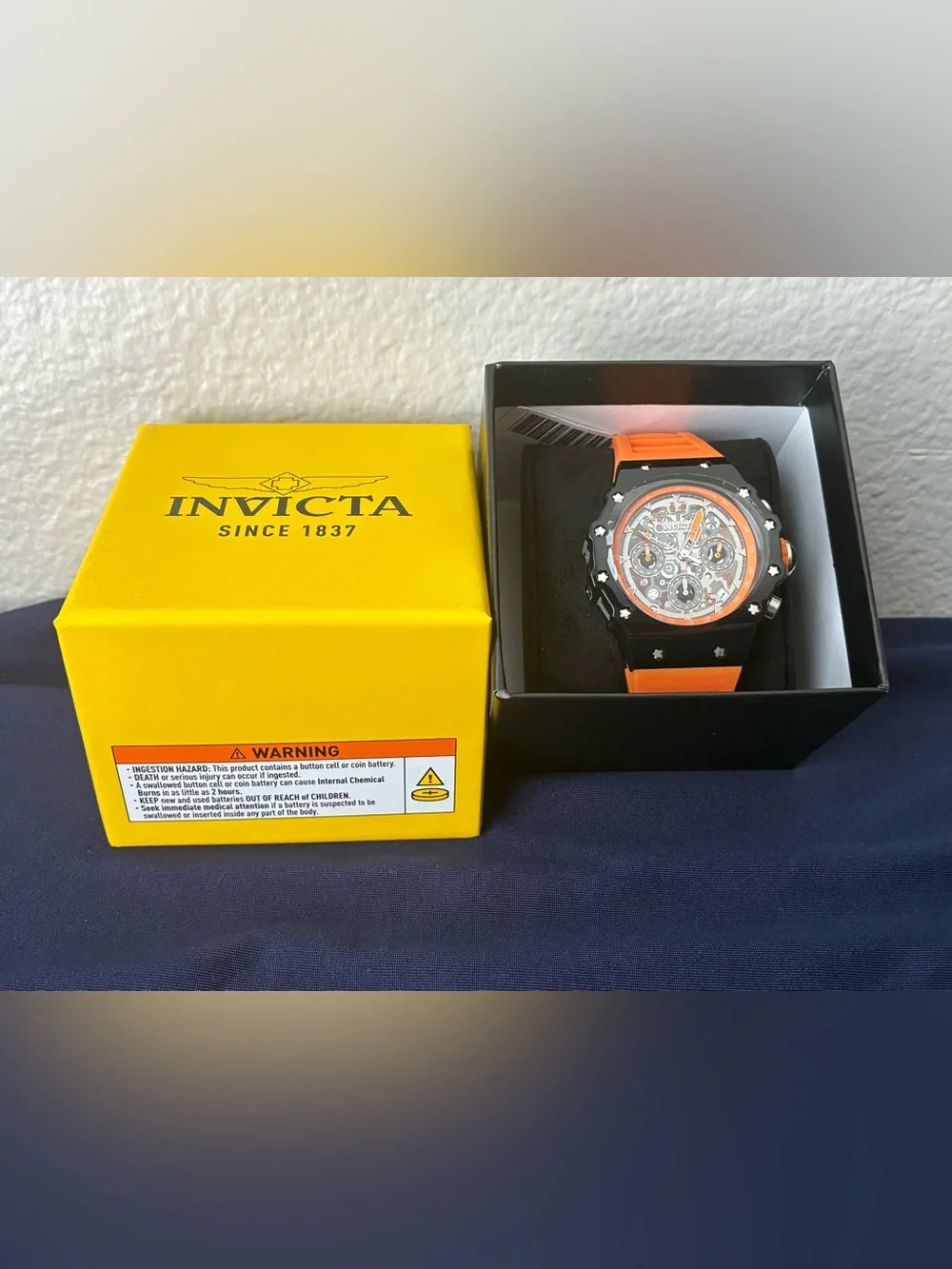 Invicta chronograph visible